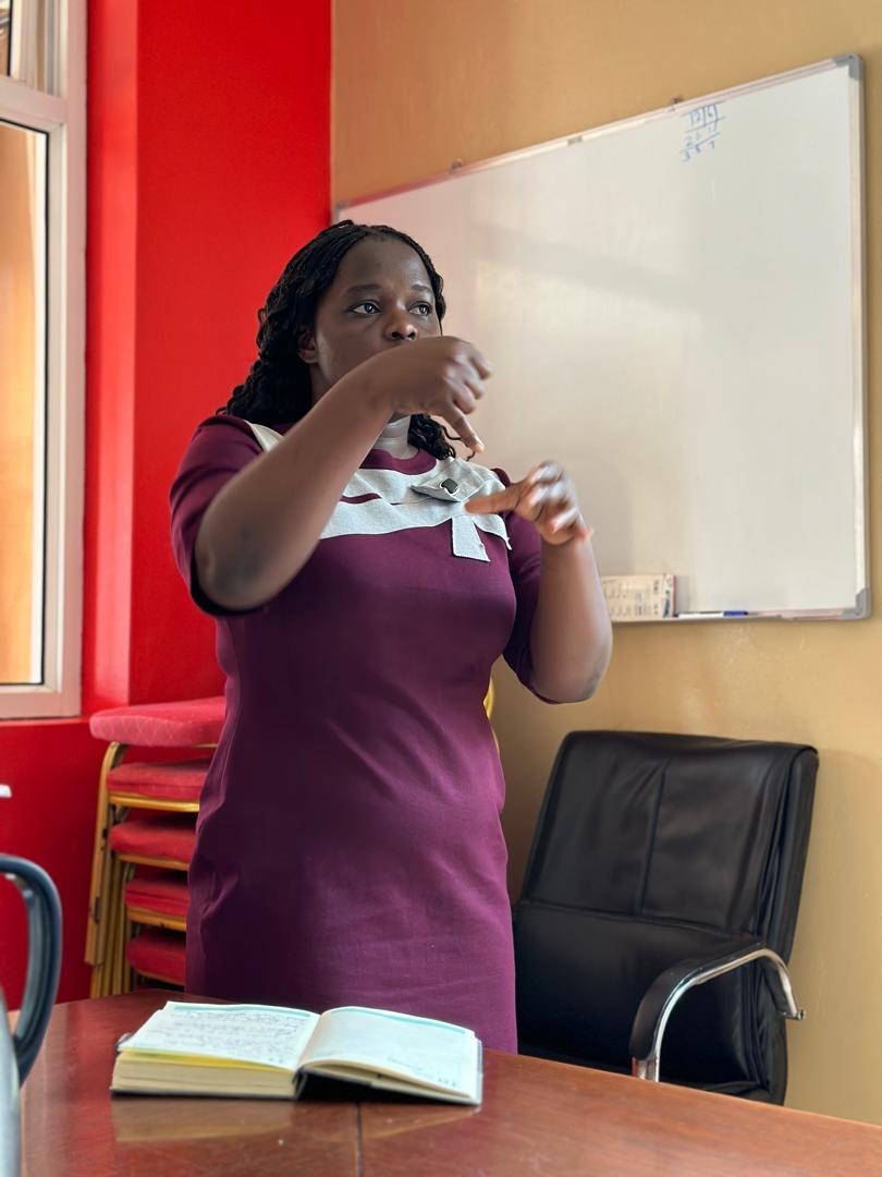 A young woman making her presentation in Sign Language